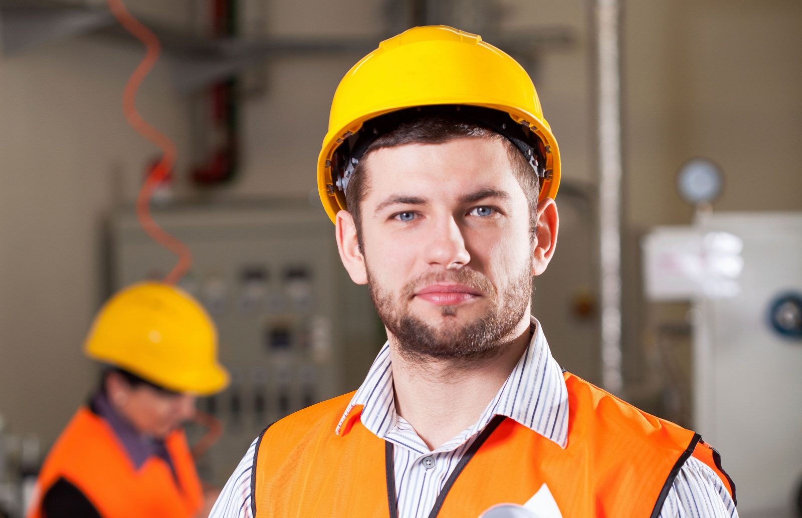 Man in hard hat in industrial factory